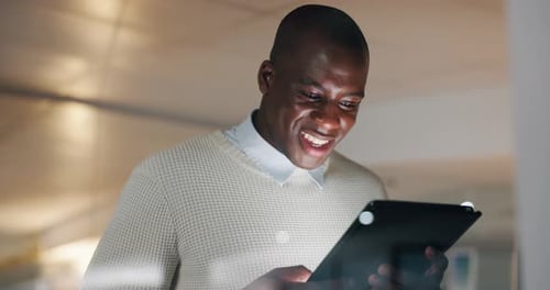 Online, office and business black man on tablet for internet, website research and communication