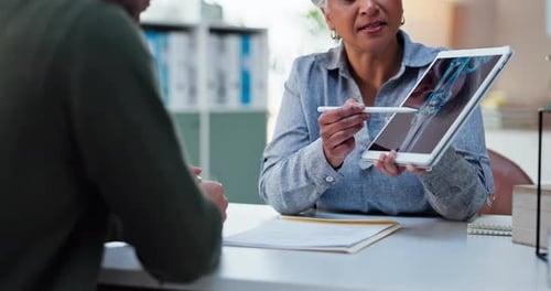 Doctor Showing Tablet with X-Ray to Patient