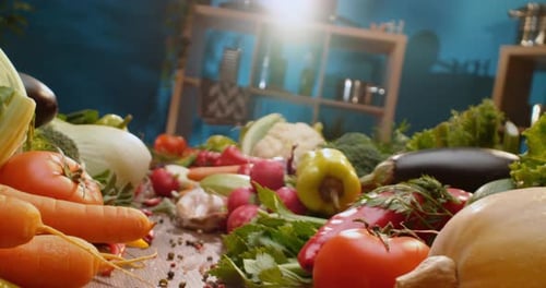 Fresh Vegetables Displayed on Table, Zucchini Being Cut