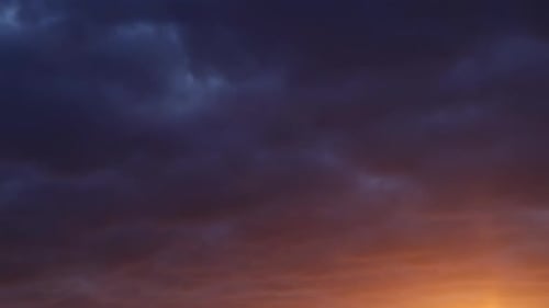 Dramatic Clouds Illuminated by Sunset Time-Lapse