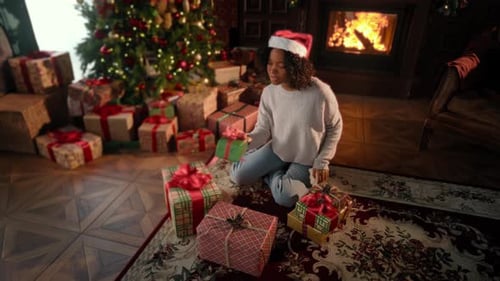Merry Christmas and Happy New Year Black Woman Opening Gifts in Xmas Morning African American Lady