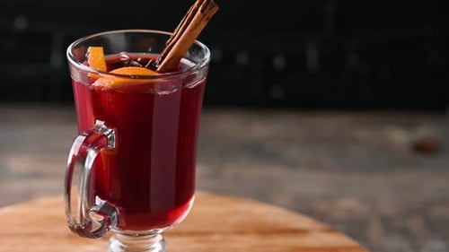 Warm Mulled Wine with Cinnamon and Orange Slice