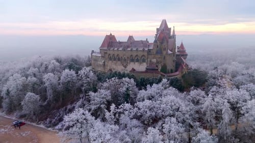 Snowy Forest And Burg Kreuzenstein Castle Near Vienna In Austria. - aerial shot