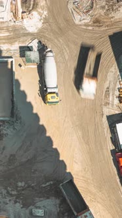 Various Machinery With Workers Are