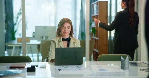 Office, typing and woman at laptop with report, review or data analysis for business plan