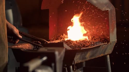 Fire in a Blacksmith's Furnace in a Blacksmith's Workshop Closeup Slow Motion