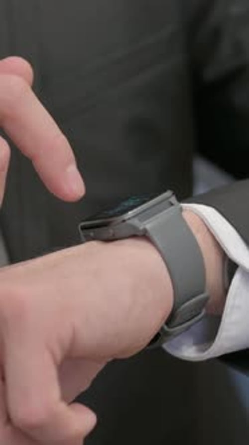 Close up of Male Hand using Smart Watch, vertical video