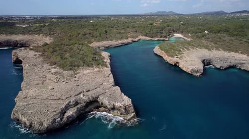 Fly over beautiful scenic rocky coastline in Mallorca, Spain. Baleric sea.