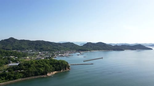 Slow cinematic drone flight over Teshima Art Island in Japanese Seto Inland Sea