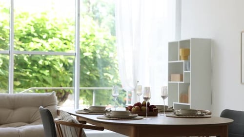 Dining Table Setting with Glassware and Fruit Bowl