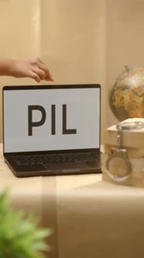Hand Opens Laptop With 'PIL' On Screen