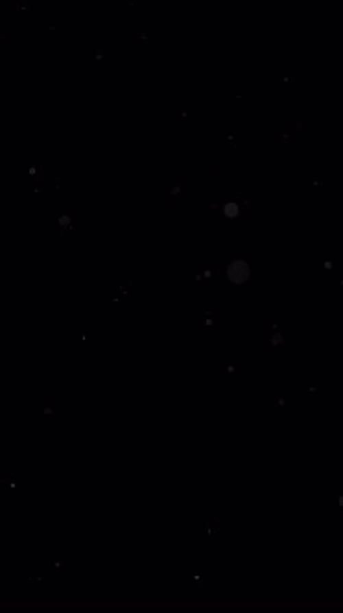 Shimmering Particles Forming Abstract Wave Pattern