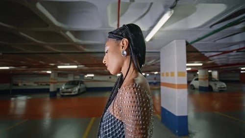 Glamorous Model Posing in an Urban Parking Garage
