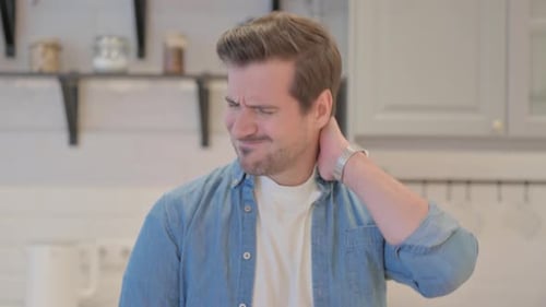 Young Adult Rubbing Sore Neck