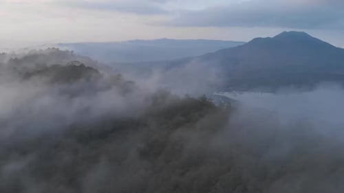 Aerial View of Mount Batur and Lake Batur in the Evening with the Evaporation of Clouds