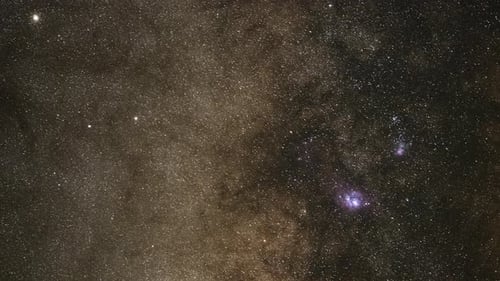 Dramatic Night Sky Filled With Bright Stars Moving In A Timelapse View