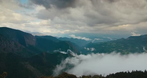 Sunset on Mountain Landscape of Altocumulus and Nimbostratus Clouds in Timelapse