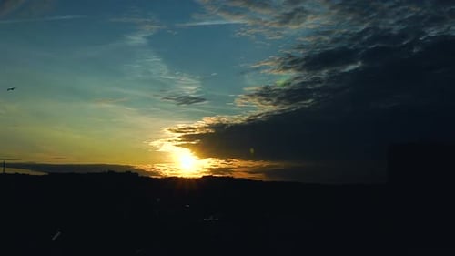 Golden Sunset Time-Lapse over Urban Cityscape