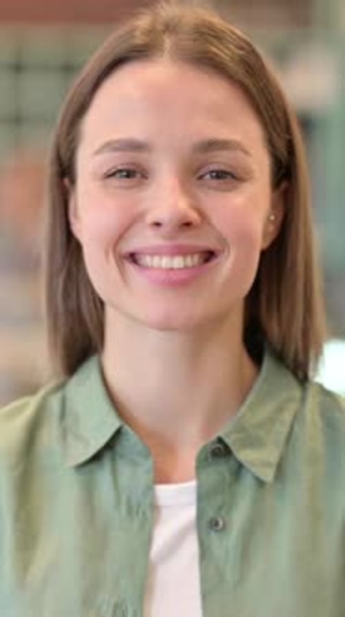 Portrait of Smiling Woman Looking at Camera, vertical video