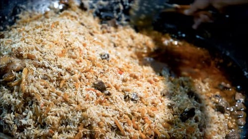 cooking delicious pilaf slow motion shot