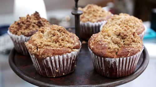 Freshly baked wholewheat muffins on display in a bakery