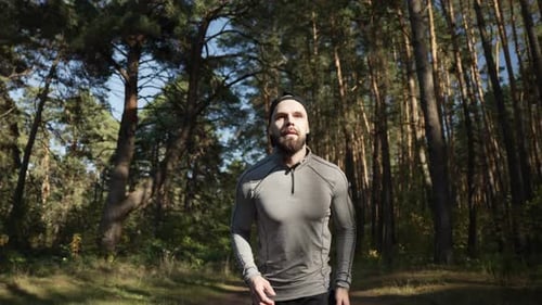 Sportsman with an Athletic Physique on a Morning Run