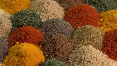 Spice and seasoning. Various fragrant spice market. Heap different Asian Spices rotated on wooden