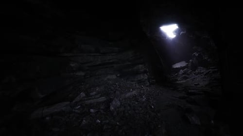 Dark Cave Passage Exploration Towards Bright Light