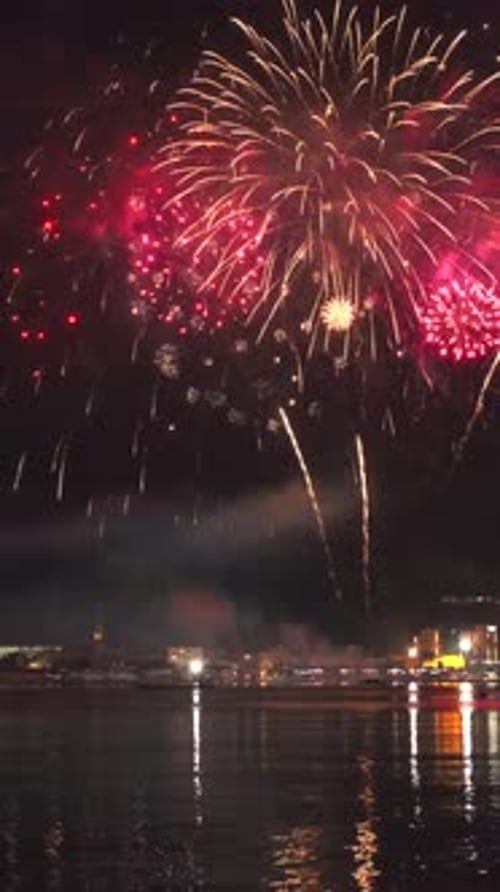 Fireworks with colorful lights over sea