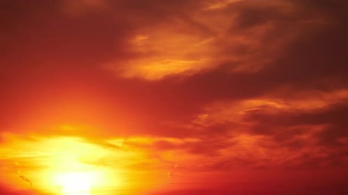 The morning sun rising above the horizon, the landscape at dawn. Summer sunrise, timelapse