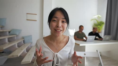 Asian Woman Presents New Project at Business Conference