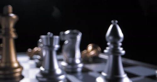 Chessboard Close-Up with Silver and Gold Pieces