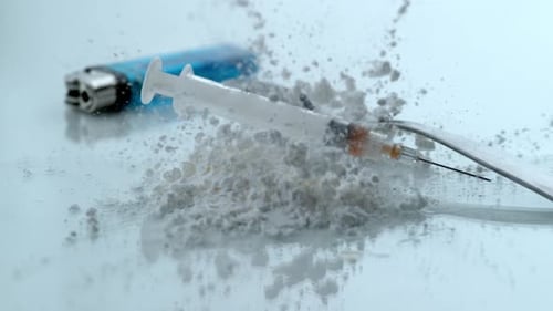 Syringe and drugs in slow motion shot on phantom flex 4k at one thousand fps