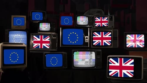 Stack of Old Televisions Displaying Flags and Static