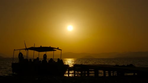 Tourists on a Boat Ride at Sunset