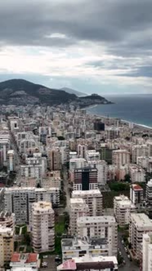 Vertical Video Coastal Turmoil Aerial View of Stormy Mediterranean Coastline and City Panorama with