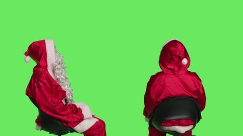 Santas Sitting on Chairs in Studio
