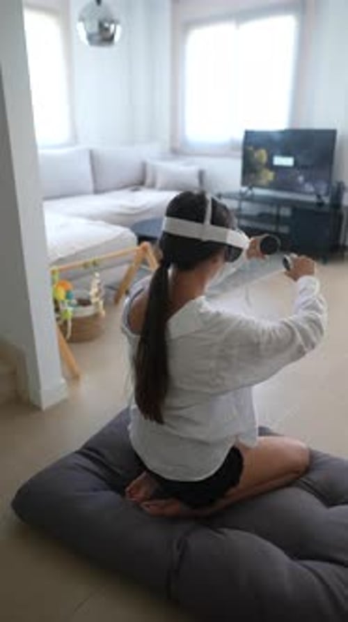 Young Person Immersed in Virtual Reality Gaming at Home
