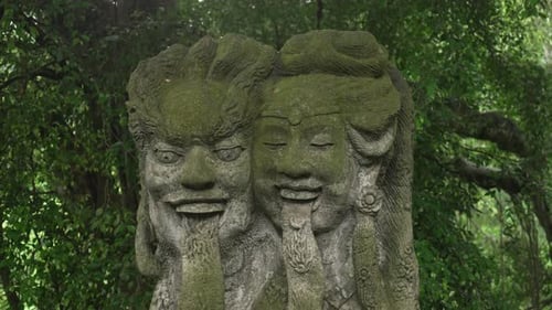 Traditional Balinese Hindu statues carved into stone Bali Ubud Indonesia