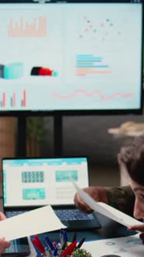 Vertical Video Goals Oriented Businesswomen Dive Deep Into Financial Reports