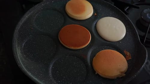 Cooking Pancakes in a Speckled Pan