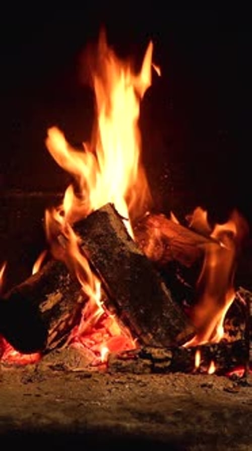 Vertical Fireplace Fire Burning Logs at Night