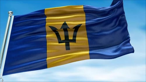 Waving Barbados National Flag Against Bright Blue Sky