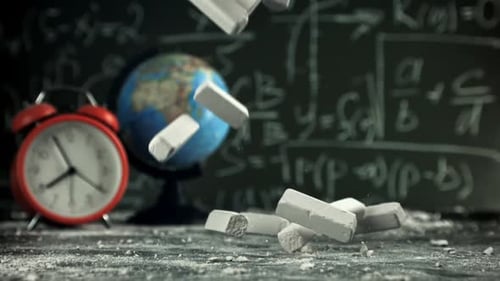 School Chalk Falls on the Desk Filmed on a Highspeed Camera at 1000 Fps