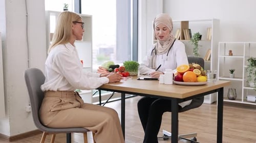 Woman consulting Doctor about Diet and Nutrition