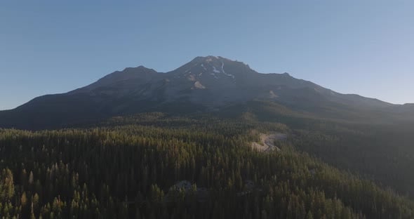 Aerial Panoramic View of Mount Shasta Overlooking Dense Pine Forests at ...