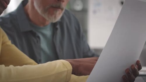 Colleagues Reviewing Data in Office Setting