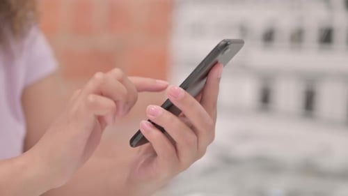 Close up of Female Hand Using Smartphone