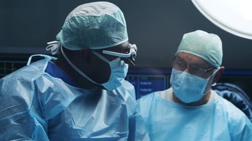 Surgeons Wearing Masks in a Hospital Operating Room