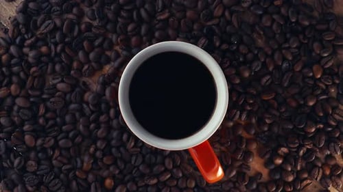 Overhead Shot of Coffee Cup with Coffee Beans